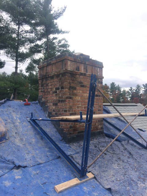 Repairing Chimney with Tools – West Springfield, MA – Rolandini Brothers Masonry