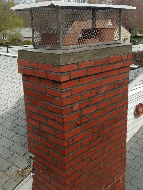 Brick Chimney with Cover – West Springfield, MA – Rolandini Brothers Masonry