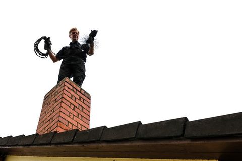 Fireplaces — Cleaning the Brick Chimney in West Springfield, MA Fireplaces — Cleaning the Brick Chimney in West Springfield, MA
