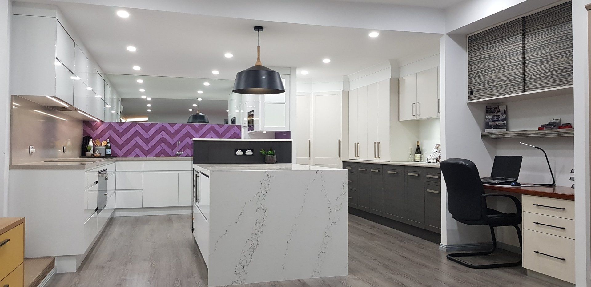 white countertop island with modern chairs