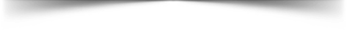 A panoramic shot of a blurry, dark urban landscape under a night sky.
