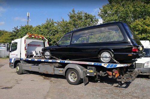 Recovered car on Ravenscroft recovery truck