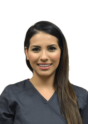 Portrait of a smiling healthcare worker in dark gray scrubs against a white background