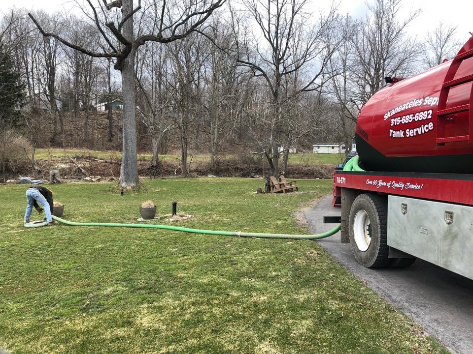 Man Pumping the Septic Tank — Skaneateles, NY — Skaneateles Excavation Inc