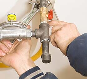 Hand of Plumber Fixing Pipes — Plumbing in Pasadena, CA Hand of Plumber Fixing Pipes — Plumbing in Pasadena, CA