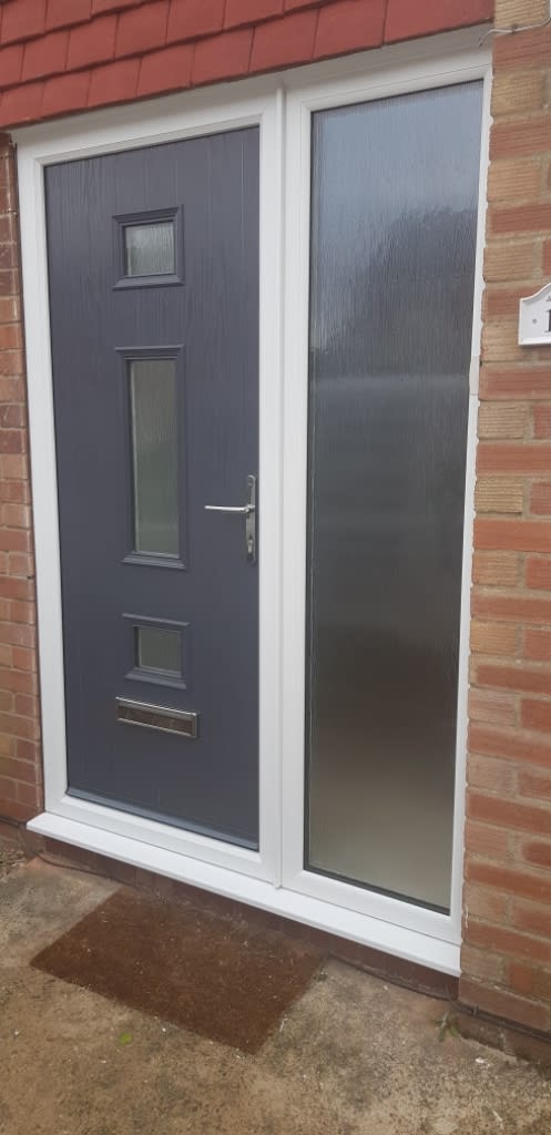 Modern black door fitted into domestic property