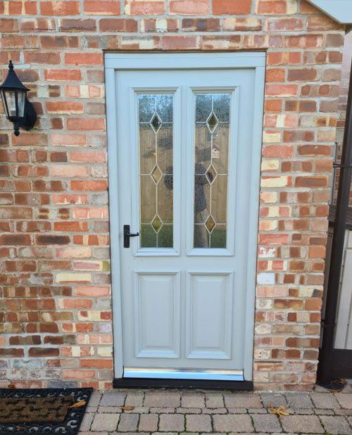 Light blue wooden door with two window panels
