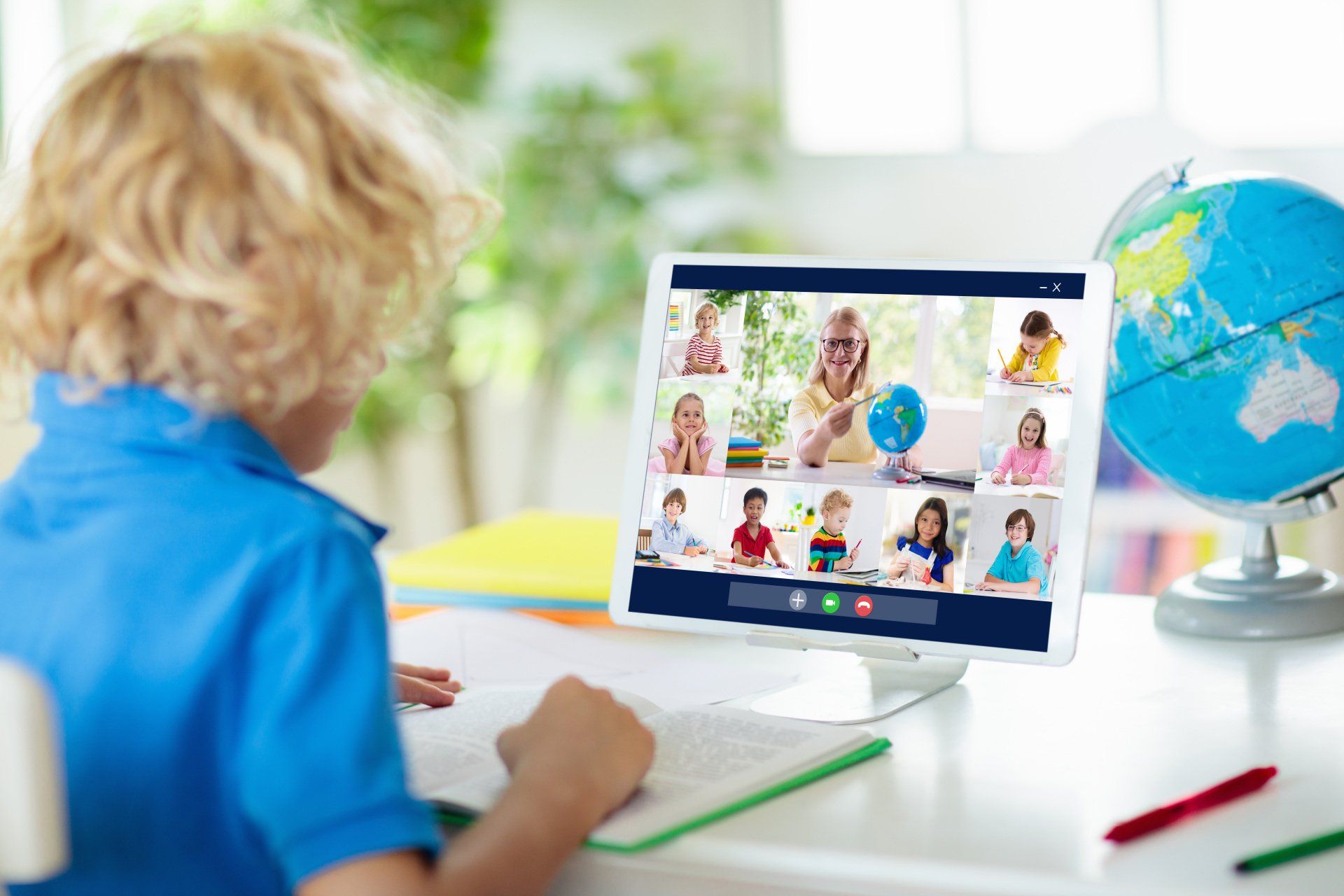 child on an online learning web call with other children and a teacher