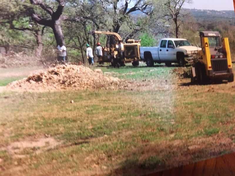 men standing around a clearing