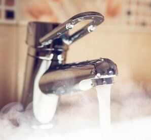 Water Tap With Hot Water Stream — Plumbing and Heating Services in East Providence, RI Water Tap With Hot Water Stream — Plumbing and Heating Services in East Providence, RI