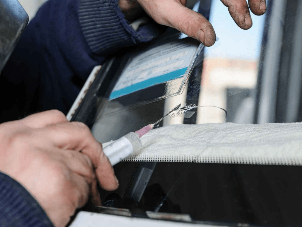 Man repairing windshield