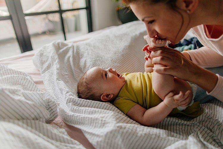 Mother Kissing Baby's feet - Dental Studio 4 Kids Lutz Florida
