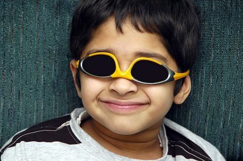 kid with glasses upside down