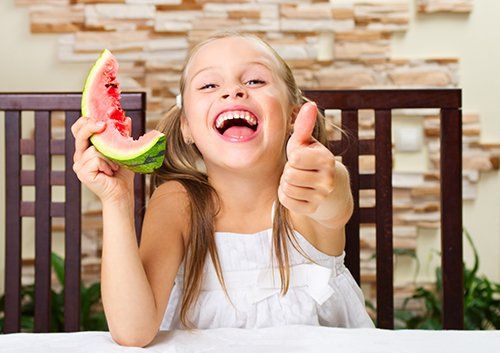 girl eating watermelon