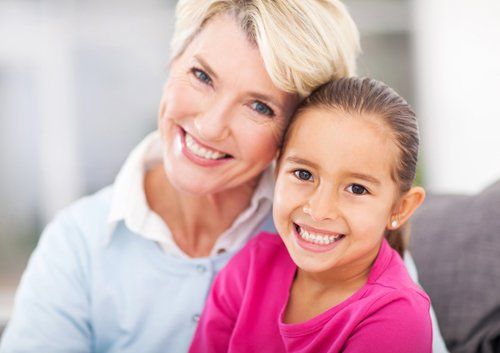 grandma and girl smiling