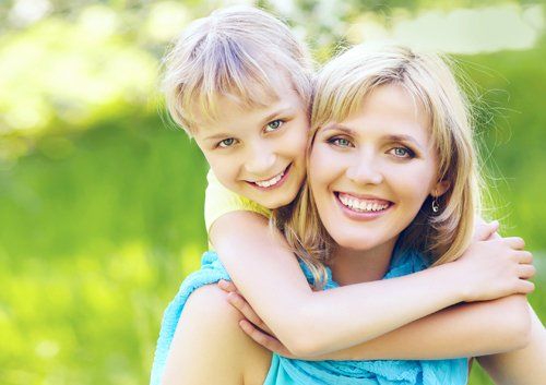 woman and daughter on back