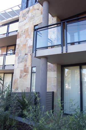 stone wall next to balcony