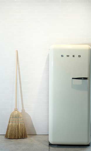 wall tiling with fridge and broom