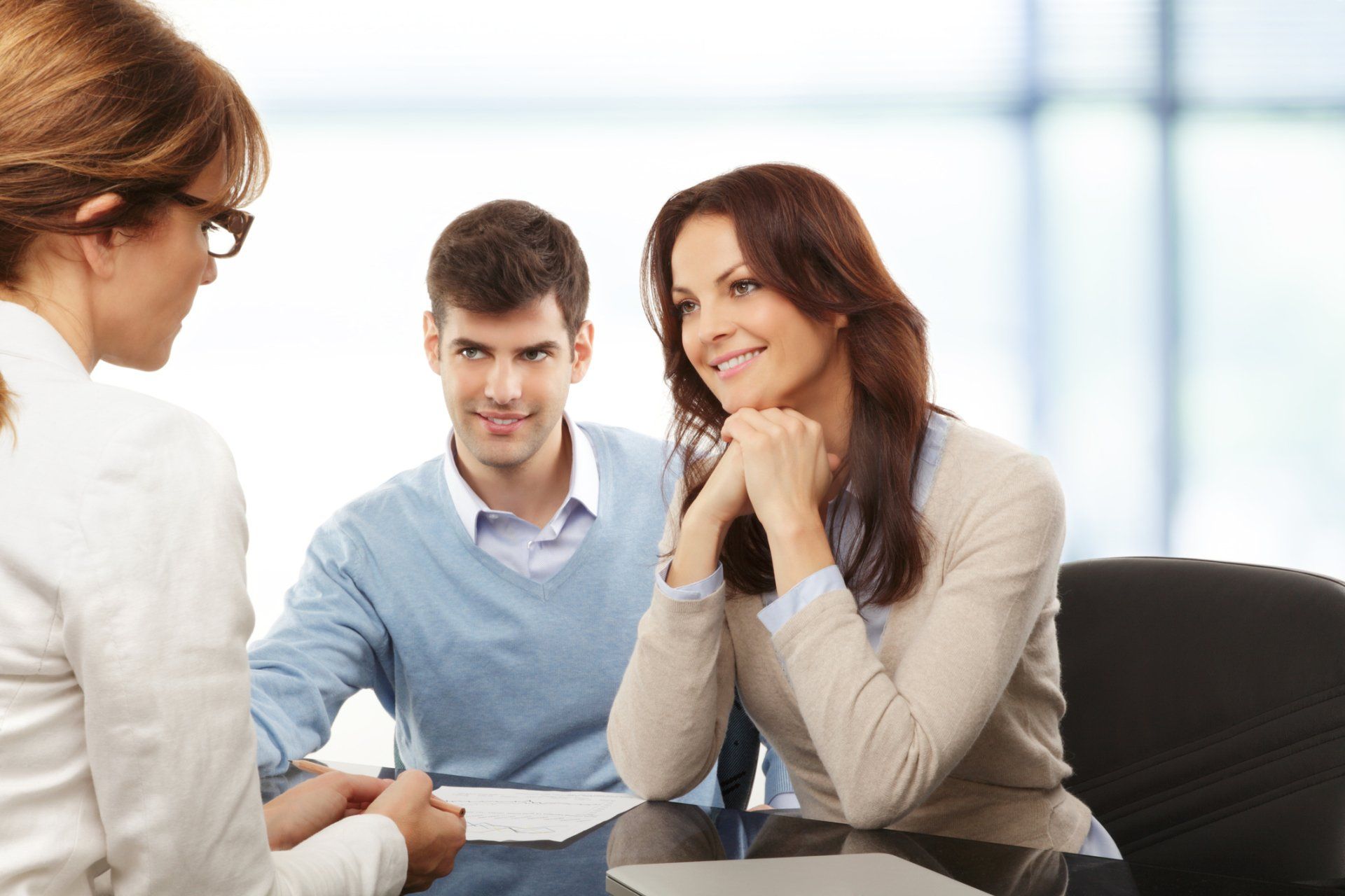 Personal Insurance — Client Smiling While Talking with Agent in Largo, FL Personal Insurance — Client Smiling While Talking with Agent in Largo, FL