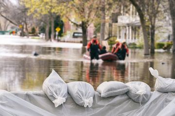 Flood Insurance — Group Of Rescuers Pulling A Rubber Boat in Largo, FL Flood Insurance — Group Of Rescuers Pulling A Rubber Boat in Largo, FL