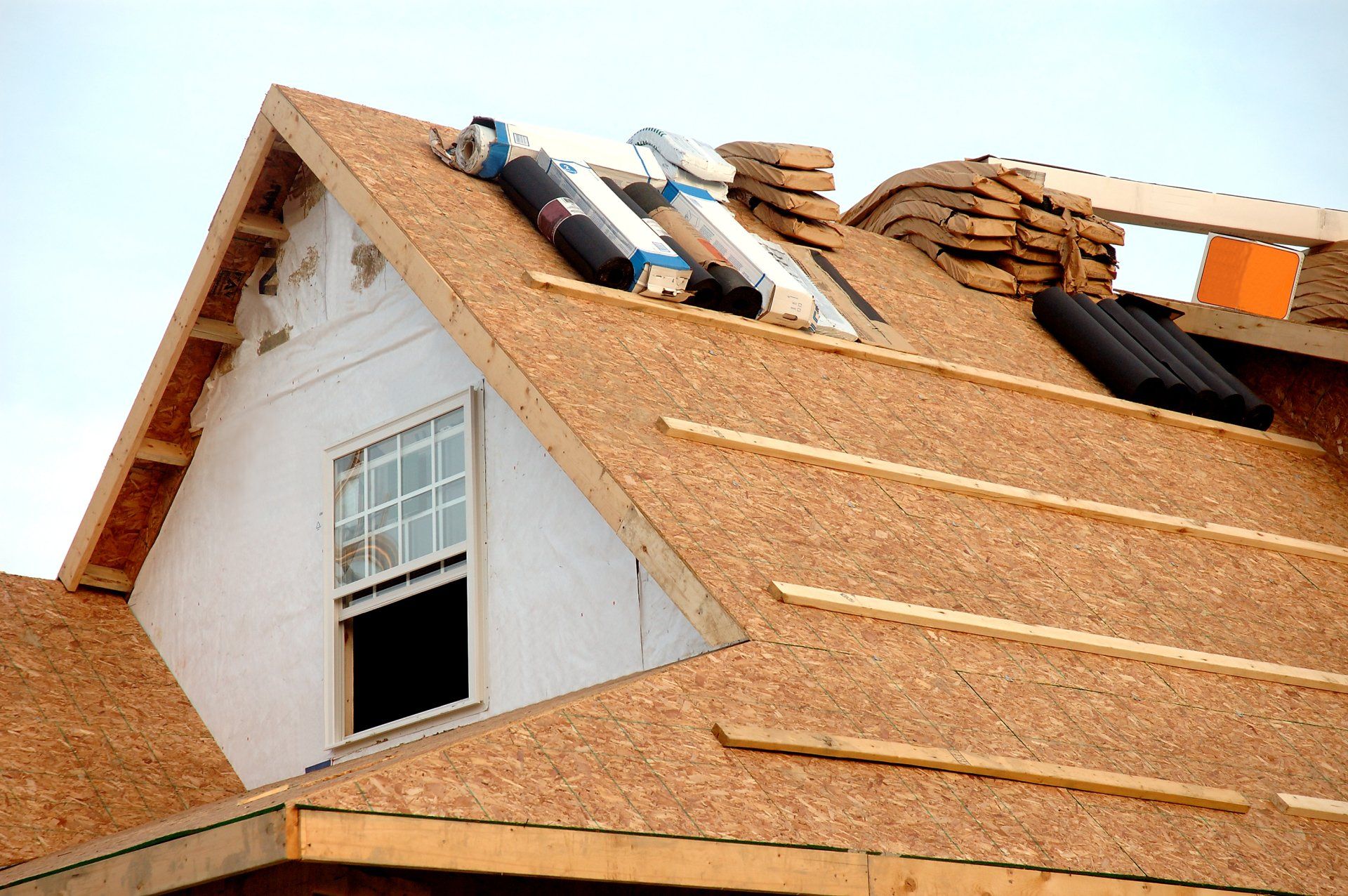 Roof being installed on a house