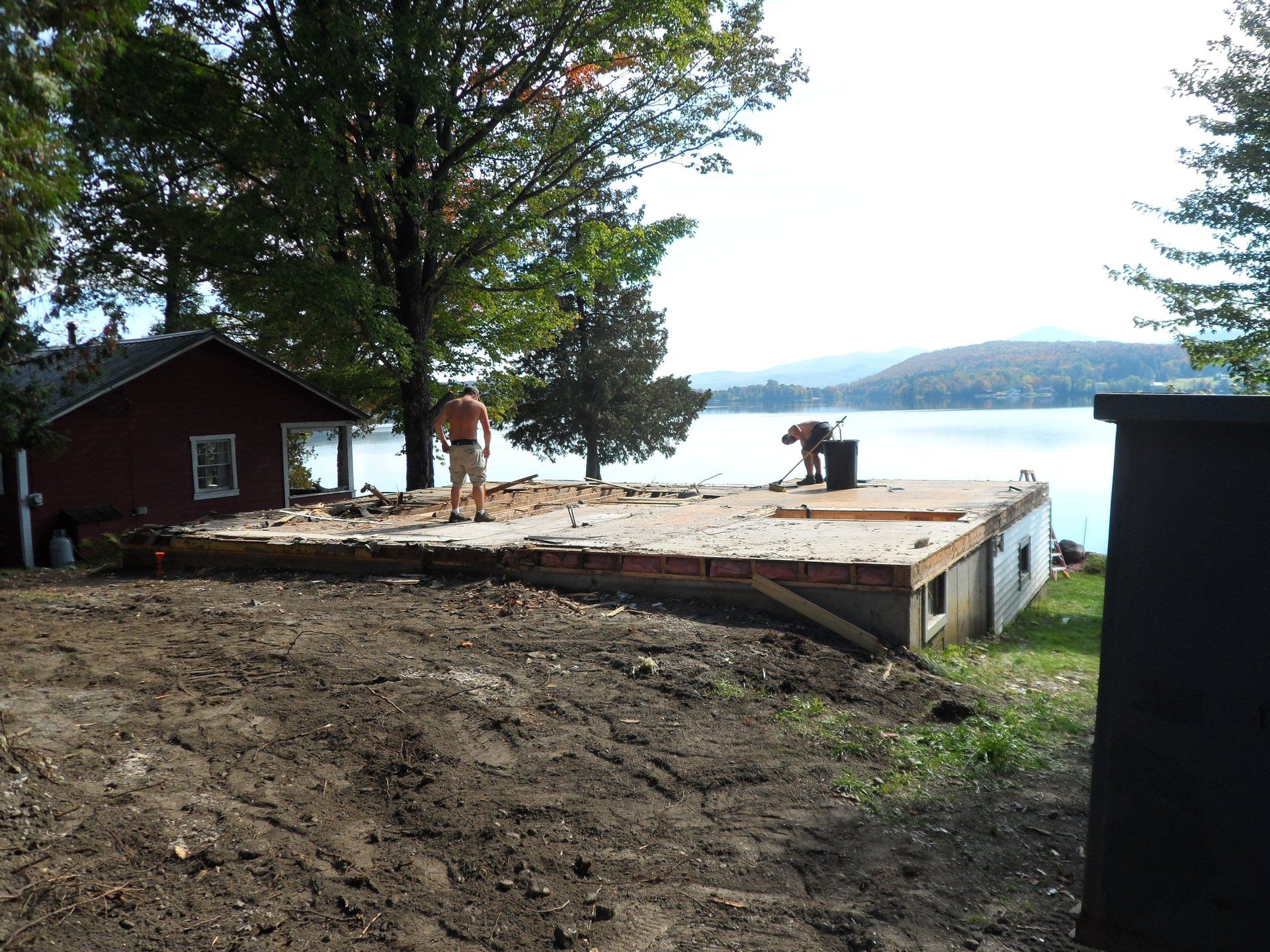 A house is being built on the shore of a lake