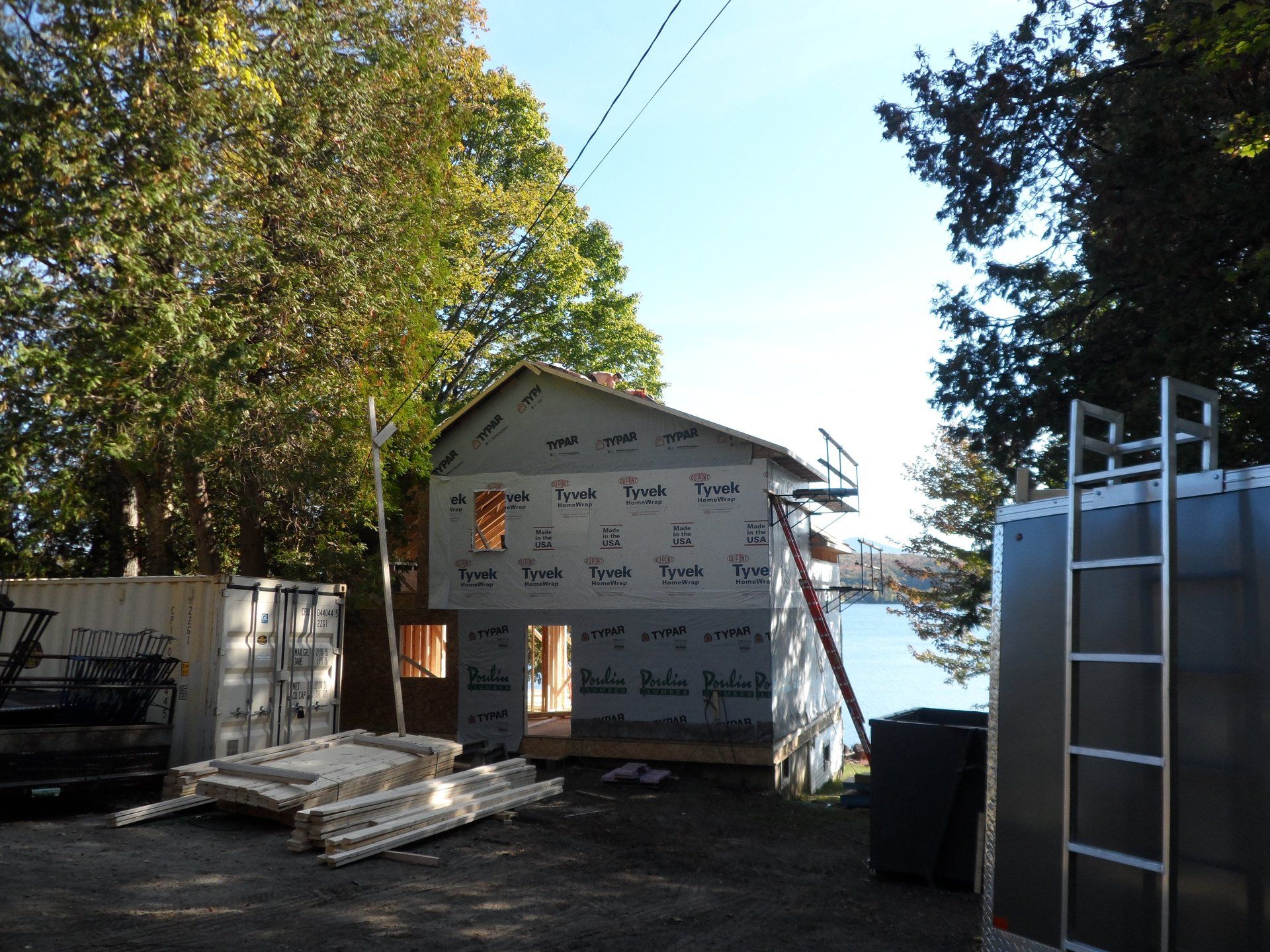 A house under construction with a ladder in front of it