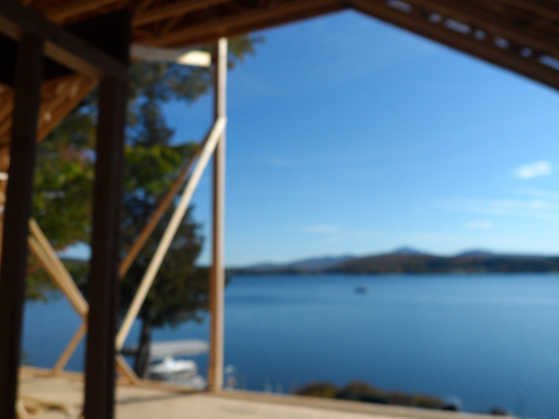 A blurred image of a body of water with mountains in the background