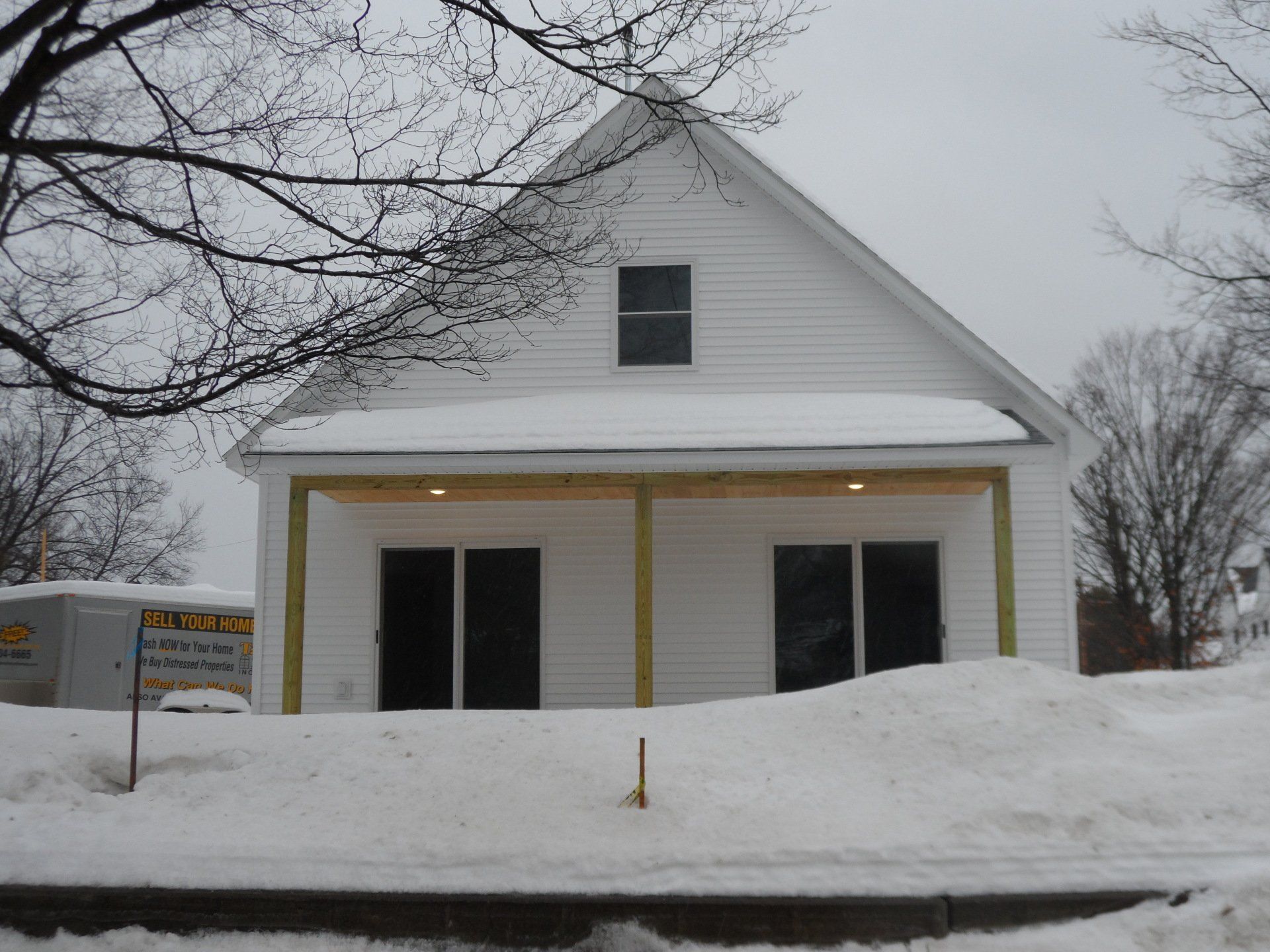 A white house with a sign that says ' u.s. army ' on it