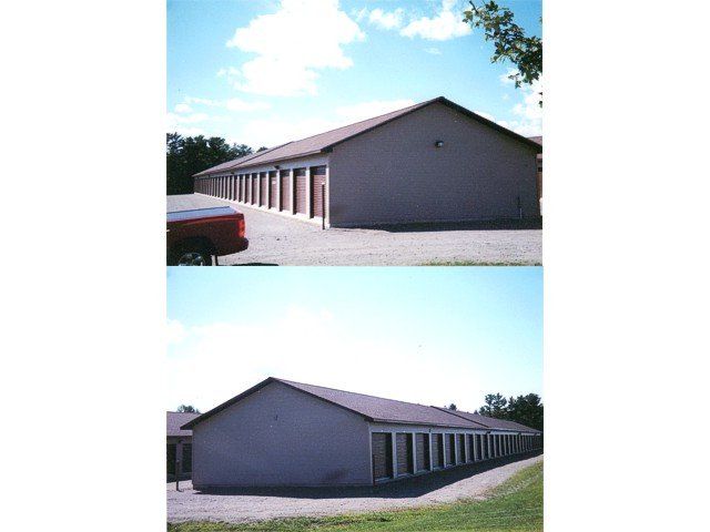 Two views of a long gray building with a red roof and rows of doors on a gravel lot