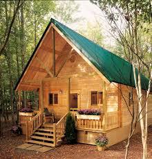 Standing Seam Roofing Installation in VT Green Standing Seam Roof Installation on a cabin in VT