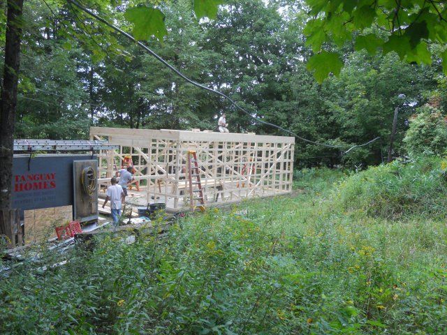 A construction site with a sign that says factory homes