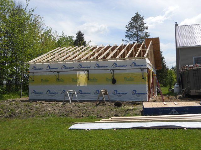 A house is being built with a roof that is being built