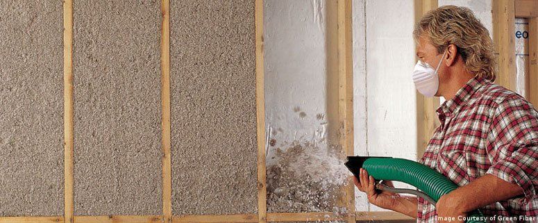 A man installs Cellulose Insulation in Newport, Vermont