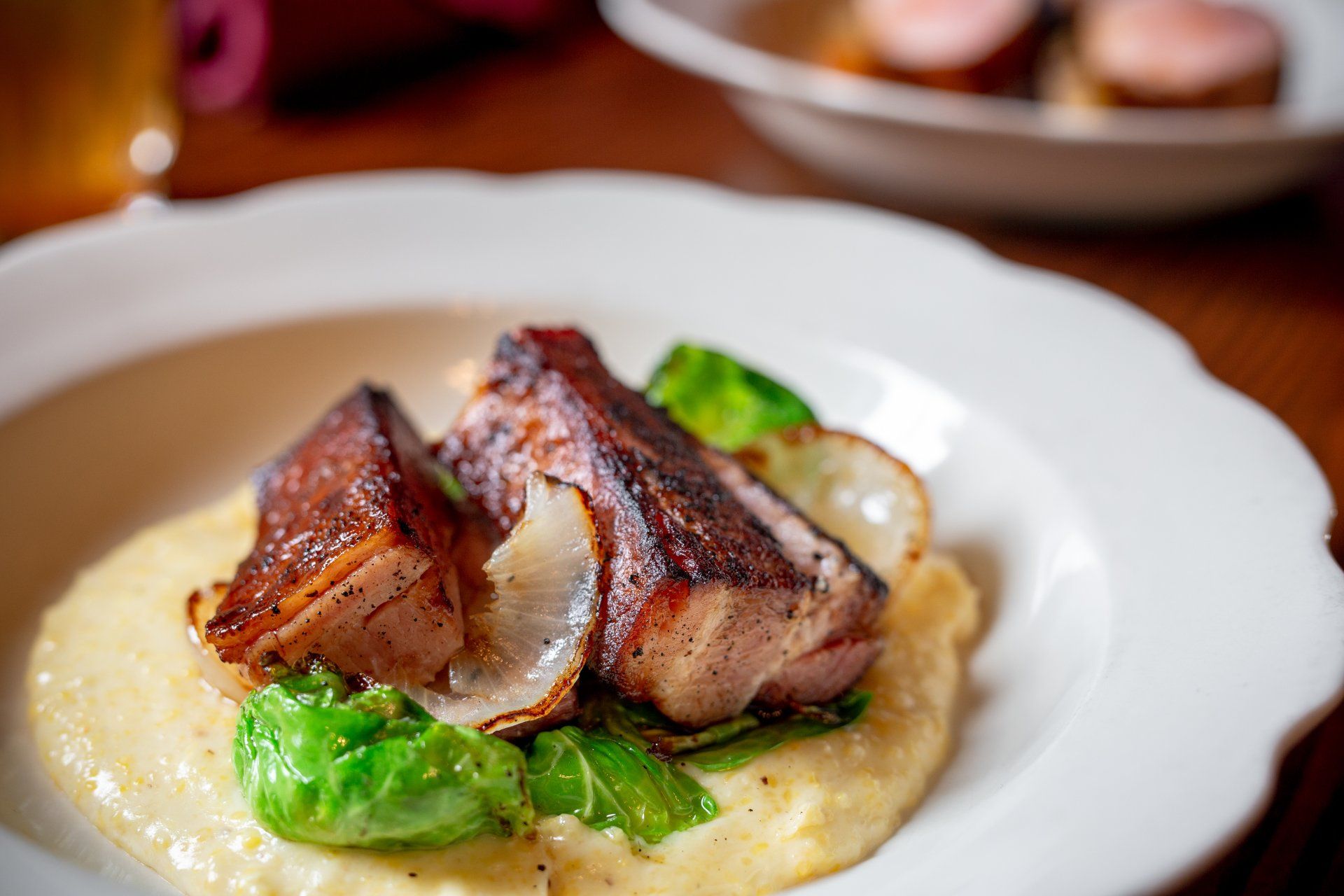 pork belly atop a corn puree at planter's house st. louis