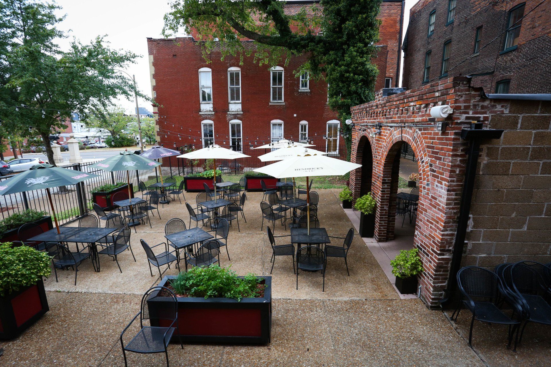 outside patio at planter's house st. louis with hanging lights and wooden tables