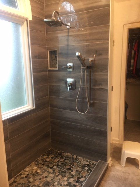 Shower Area with Pebble Floor — Concord, NC — Gray’s Flooring and Custom Showers
