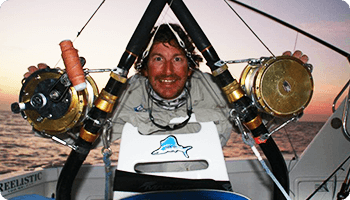 Man and two fishing rods — dean jackson guided tours in Winnellie, NT