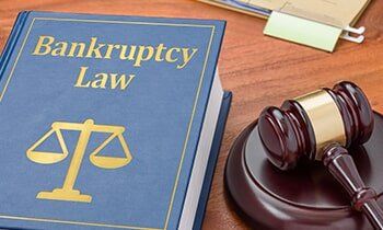 Law book with a gavel - trial attorney in Dubuque, IA