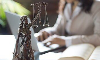 Lawyer working on a laptop- consumer protection in Dubuque, IA
