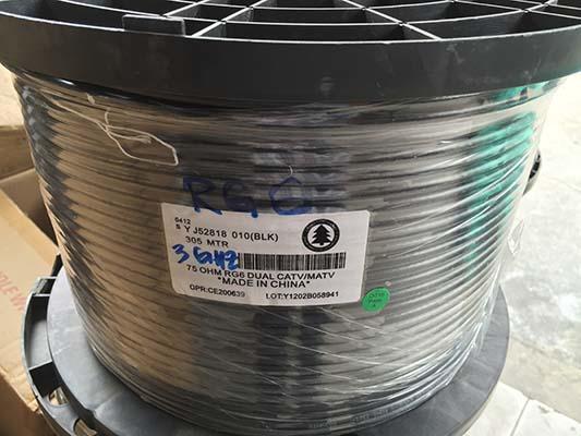 Spool of black coaxial cable with label, marked 