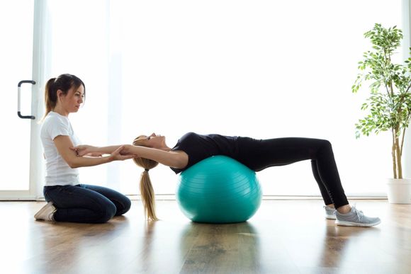 Physical Rehabilitation — Physiotherapist Helping Patient in Middleburg, VA Physical Rehabilitation — Physiotherapist Helping Patient in Middleburg, VA