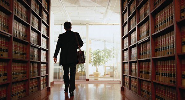 Lawyer Exiting in Library - Lawyer in Jacksonville, NC Lawyer Exiting in Library - Lawyer in Jacksonville, NC