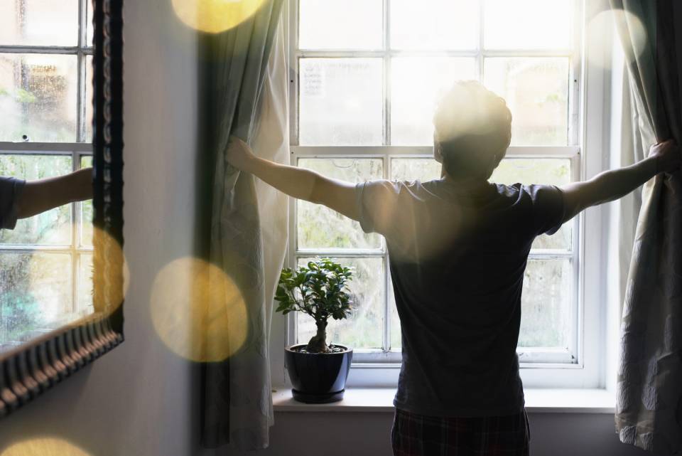 Man opening windows