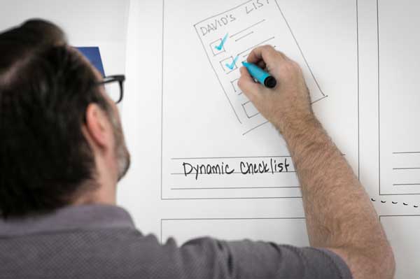 Man-Whiteboard-Checklist