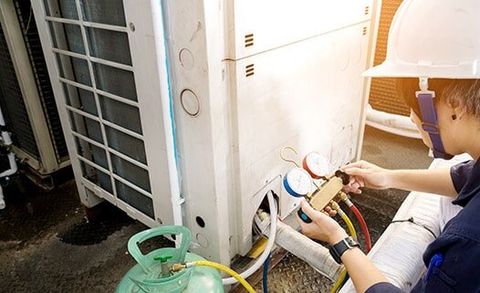 Technician is Checking Gauge — Heating Repair Service in Paso Robles, CA