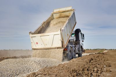 Truck Hauling and Dumping Gravel — Calvert County, MD — Middleton Backhoe Service LLC Truck Hauling and Dumping Gravel — Calvert County, MD — Middleton Backhoe Service LLC