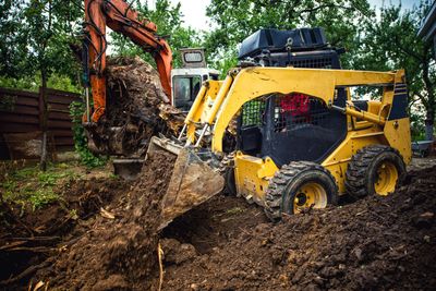 Professional Excavator on Top of a Dirt Hill — Calvert County, MD — Middleton Backhoe Service LLC Professional Excavator on Top of a Dirt Hill — Calvert County, MD — Middleton Backhoe Service LLC