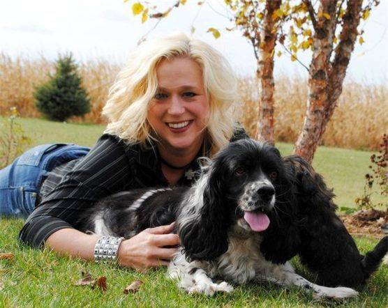 Kimberlee playing outside with her dogs