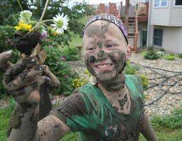 Kimberlee's daughter after finding flowers and playing in the mud